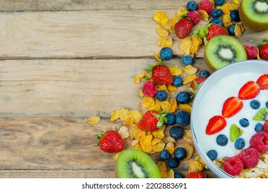 Top Down View Of Cereal And Berries On The Bowl With Copy Space On The Wooden Table