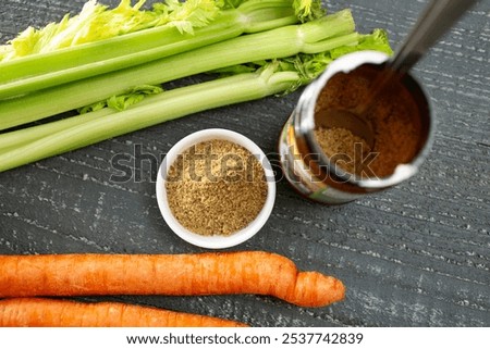 A top down view of a condiment cup of beef bouillon.