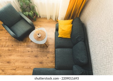 Top Down View Cozy Apartment Living Room With Sofa And Yellow Pillows Stylish Table With Autumn Flower By Window.Fall Autumn Colors Palettes