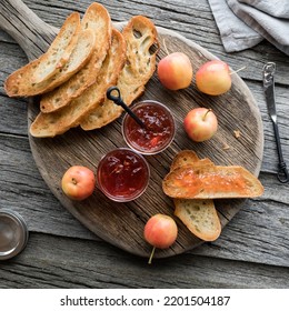 Top Down View Of Crab Apple Jelly Served With Toasted Sourdough Bread. 