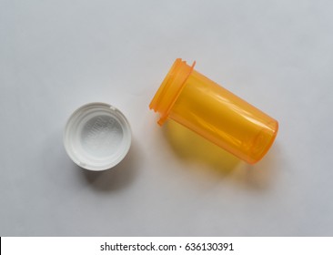 Top Down View Of An Empty Orange Pill Bottle. Healthcare And Health Insurance Concept