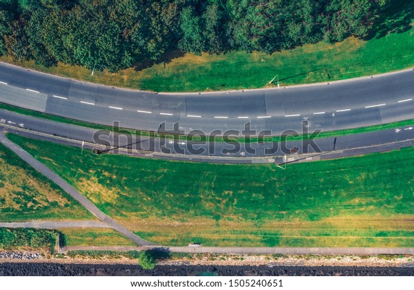 Top down\
view empty  street in Clontarf area Dublin.Empty road with natural\
green  fields on sides. Alfie Byrne\
road
