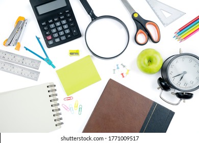 Top Down View Of Fresh Green Apple With School Supplies On The Table. Isolated On White Background