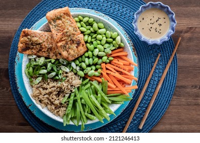 Top Down View Of A Freshly Made Asian Salmon Salad Bowl, Ready For Eating.