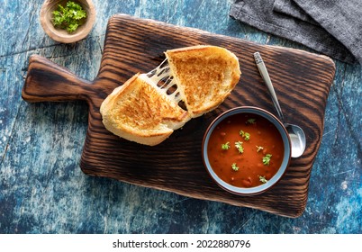 Top Down View Of A Grilled Cheese Sandwich With Tomato Soup, Ready For Eating.