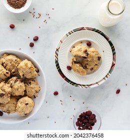 Top Down View Of Homemade Cranberry Flax Breakfast Cookies With A Bottle Of Milk, Ready For Eating.