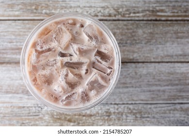 A Top Down View Of An Iced Milk Tea Beverage.