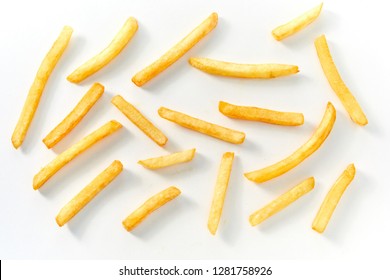 Top down view of long cut french fries on white background