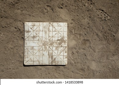 Top Down View On A Baseball Base On A Dirt Infield, With Space For Text On The Right