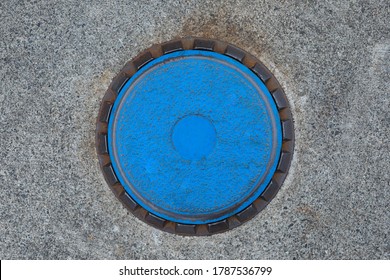 Top Down View On The Cap Of An Underground Gas Tank, At A Fueling Station