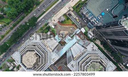 Top down view on different sky scrapers in a big city, fly over.