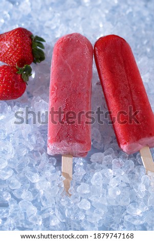 Similar – Foto Bild Erdbeer-Popsicle auf schwarzem Stein