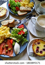 Top Down View Of Our Breakfast: Scramble, Salmon, Fresh Salad, Tart And Coffee