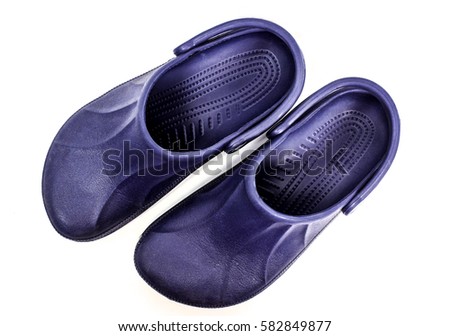 Top down view of a pair of blue clogs or crocs shoes