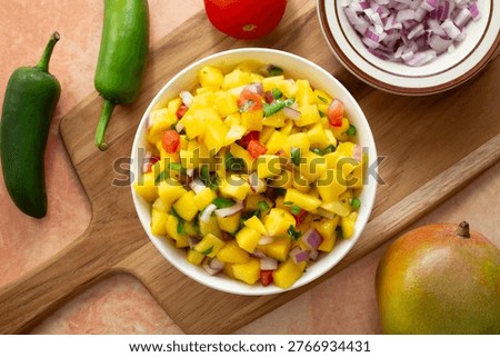 A top down view of a pile of mango salsa.