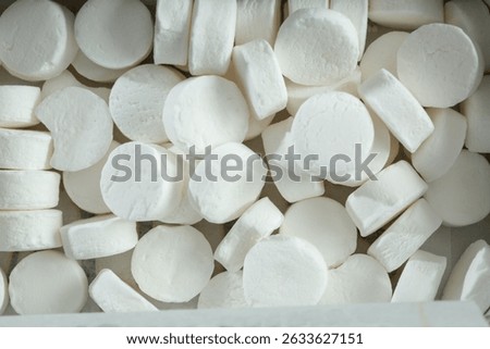 A top down view of a pile of mints.