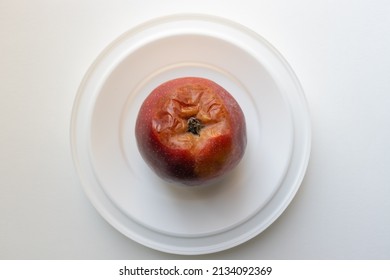 Top Down View Of A Red Apple Is Rotting