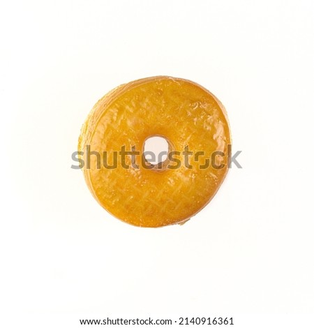 Top down view of a Regular Glazed Donut on white background with copy space.