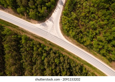 Top Down View Of Road Intersection In The Forest At Summer, Drone Shot