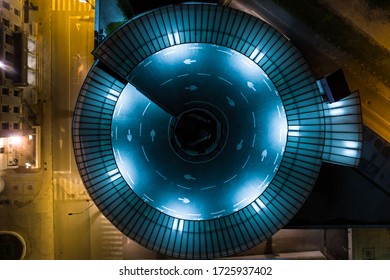 Top down view of a round parking garage at night - Powered by Shutterstock