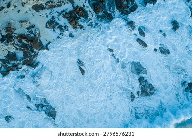 Top down view of sand patterns created by flowing water The Concept of coastal erosion