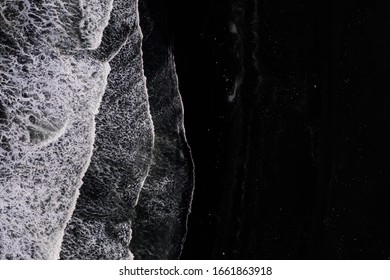 Top Down View Of Sea Waves At Black Sand Beach