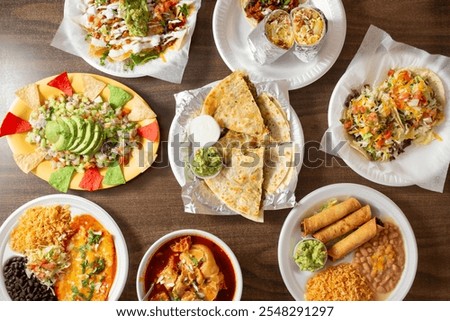 A top down view of several Mexican entrees.