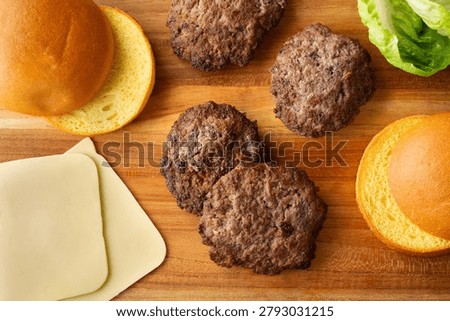 A top down view of some bison burger patties.