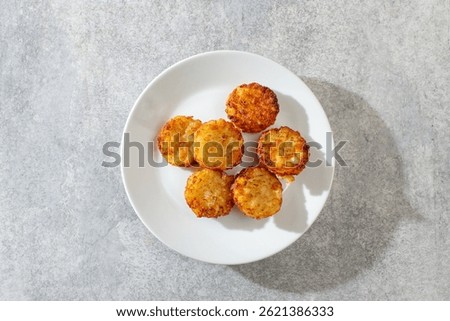 A top down view of some hash brown bites.