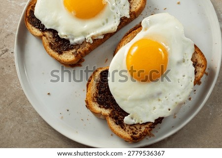 A top down view of some vegemite egg toast.
