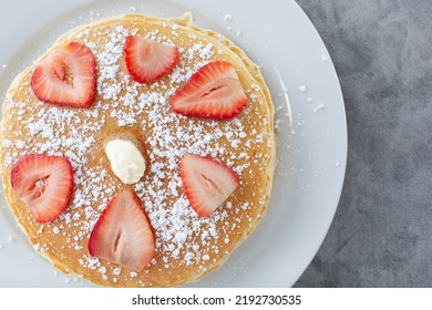 A Top Down View Of A Stack Of Pancakes On A Plate.