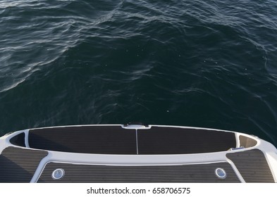 Top down view of stern end of a boat in water