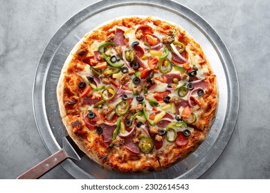 A top down view of a supreme pizza. - Powered by Shutterstock