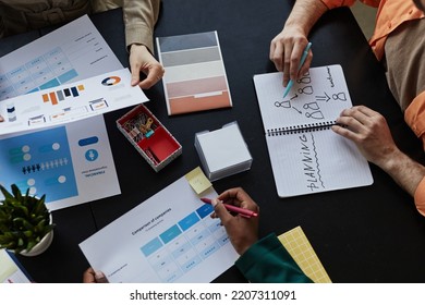 Top Down View At Table With Documents And Diverse Team Planning Design Project