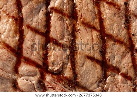 A top down view of a T-Bone steak, as a background.