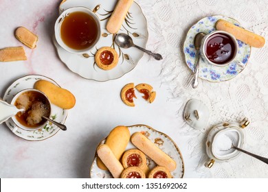 A Top Down View Of A Tea Party With Tea And Biscuits.