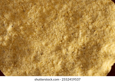 A top down view of a tostada shell, as a background.