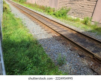 A Top Down View Of A Train Tracks With Gravel On Either Side Of It.