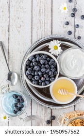 Top Down View Of A Tray Of Ingredients Used In Making A Blue Spirulina Yogurt Bowl.