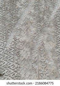 Top Down View Of Truck Tire Tracks In Sand. Wheel Motorcycle Traces  Through The Desert - Adventures Of Desert Off-road.