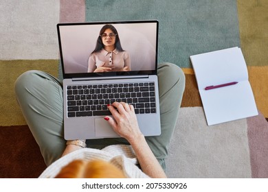 Top Down View At Unrecognizable Young Woman Using Laptop While Studying Online At Home