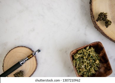 Top Down View Of Vape Pen, Shake, Marijuana Buds On Wood - Cannabis Dispensary Products 