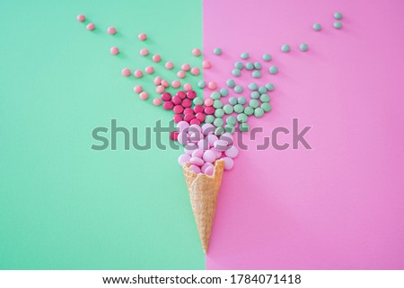 Similar – Ice cream cone with heart and moon shaped marshmallows on top