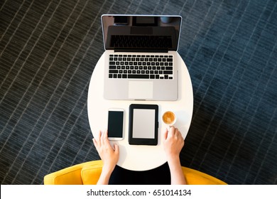 Top Down View Of Woman With Digital Devices And Coffee