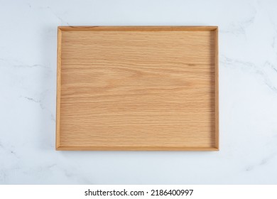 A Top Down View Of A Wood Food Tray.