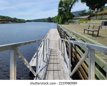 A Top Down View Of A Wooden Ramp Leading To A Boat Launch Area.