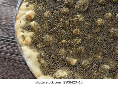 A top down view of a za'atar flatbread.
