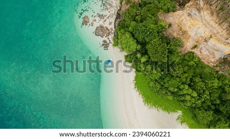 Top drone view of island coastline scenery at Lima Island or Pulau Lima in Mersing, Johor, Malaysia