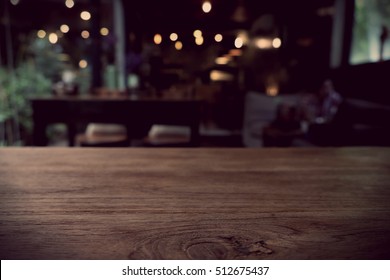 Top of empty wood table with Bar Cafe Restaurant blurred background, product display template, Business presentation - Shutterstock ID 512675437