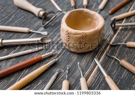 Top flat view of Pottery art tools, manual craft work concept